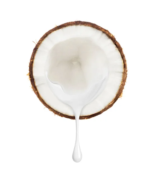 Milk flows from a slice of coconut on a white background — Stock Photo, Image