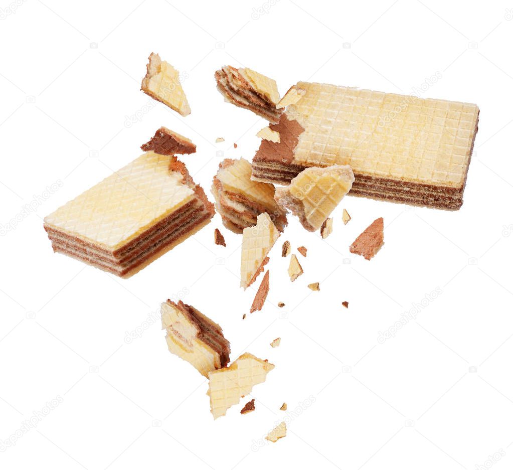 Waffles broken into pieces, isolated on a white background