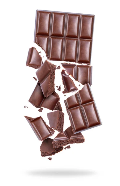 Chocolate poroso partido em pedaços no ar — Fotografia de Stock
