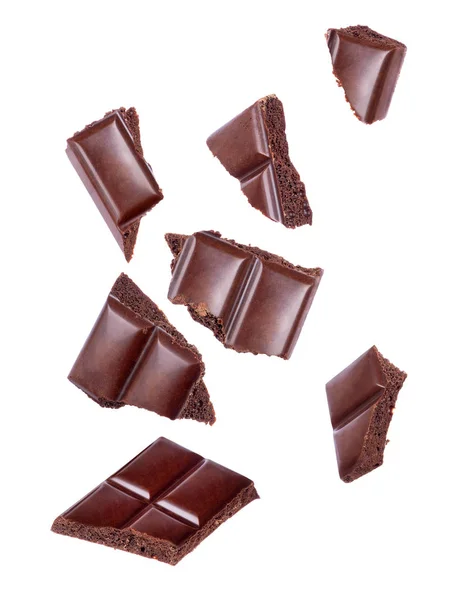 Poröse Schokoladenstücke Die Aus Nächster Nähe Auf Weißem Hintergrund Fallen — Stockfoto
