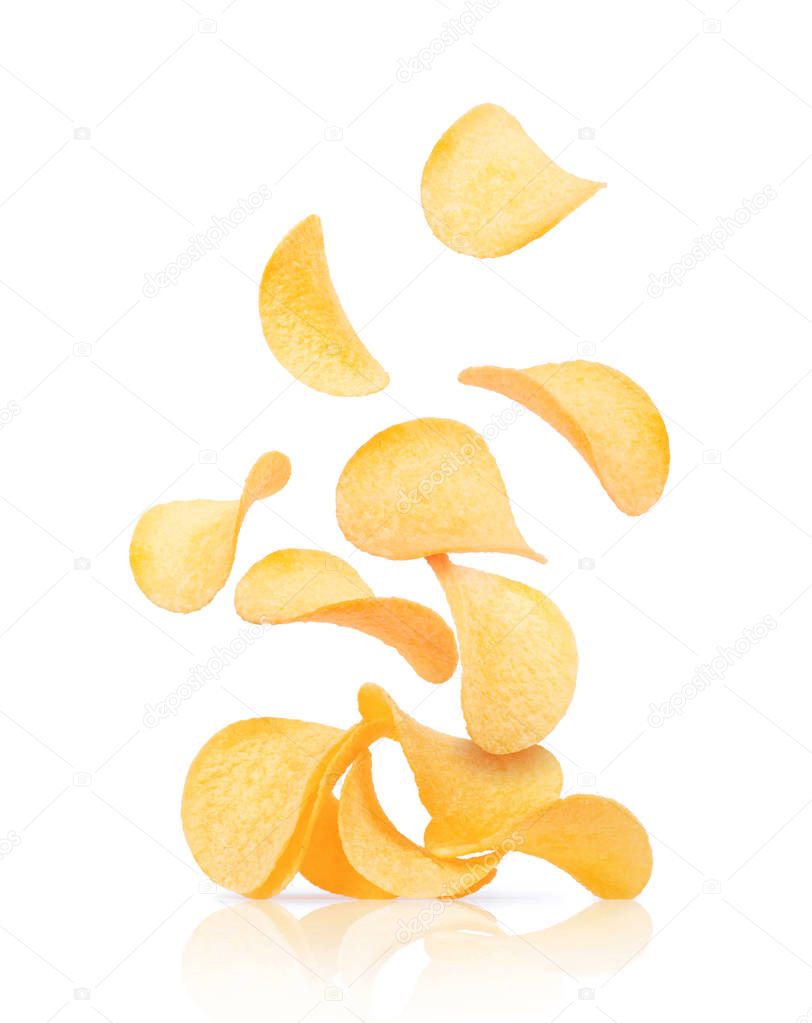 Potato chips fall on a heap with chips isolated on a white 