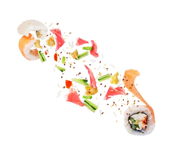 Os ingredientes voam para fora dos rolos de sushi desdobrados em branco — Fotografia de Stock