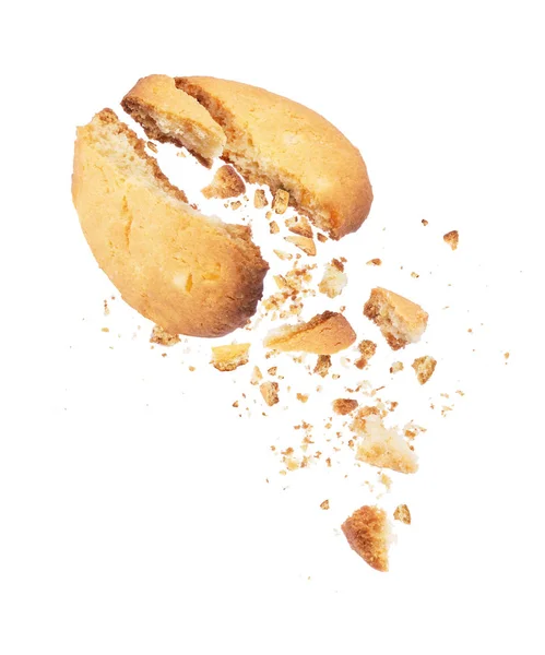 Печиво розбивається на дві половинки з падаючими крихтами вниз — стокове фото