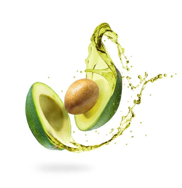 Avocado a fette con schizzi isolati su sfondo bianco — Foto Stock