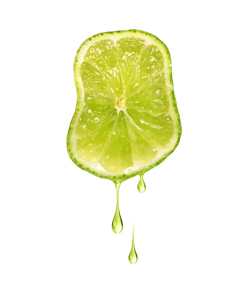 Drops of juice dripping from sliced lime isolated on a white background — Stock Photo, Image