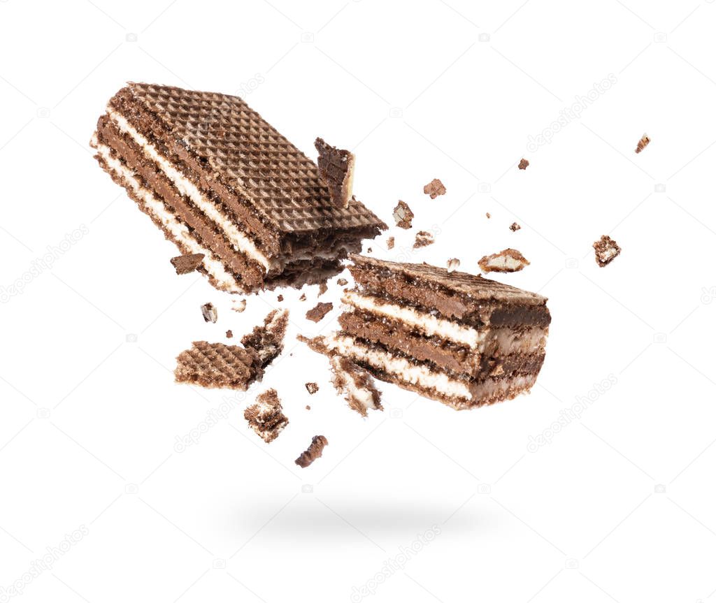 Chocolate waffles broken into two halves isolated on a white background 