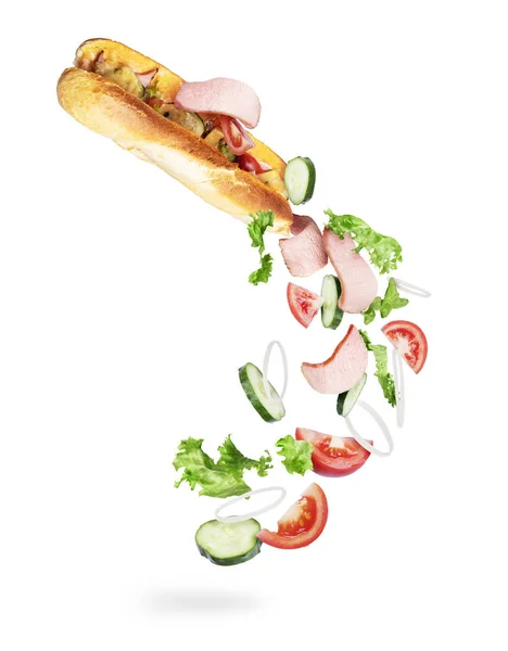 Інгредієнти падають з бутерброду в повітрі на білому тлі — стокове фото