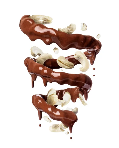 Chocolade spatten in spiraalvorm met fijngestampte cashewnoten, geïsoleerd op een witte achtergrond — Stockfoto