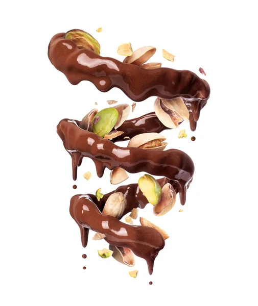 Chocolate espirra em forma espiral com pistache esmagado, isolado em um fundo branco — Fotografia de Stock