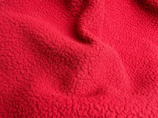 Θρυμματισμένο ζεστό κόκκινο πολικό fleece ύφασμα closeup — Φωτογραφία Αρχείου