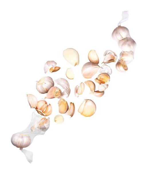 Garlic Cloves Fly Out Mesh Bags Isolated White Background — Stock Photo, Image