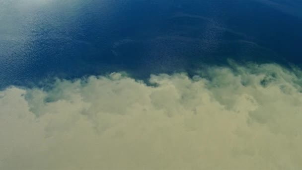 Merging water of different colors Meeting dirty and clean water top View 4k — Stock Video