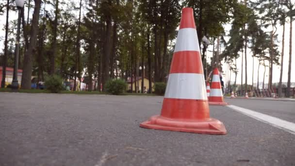 Cyclist go round traffic cones. Young handsome man riding a vintage bicycle. Sporty guy cycling at the park. Healthy active lifestyle. Low angle of view Close up Slow motion — Stock Video