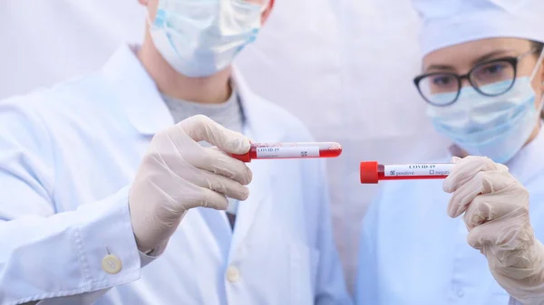 Male Female Doctors Holds Test Tube Blood Sample Coronavirus Two — Stock Photo, Image