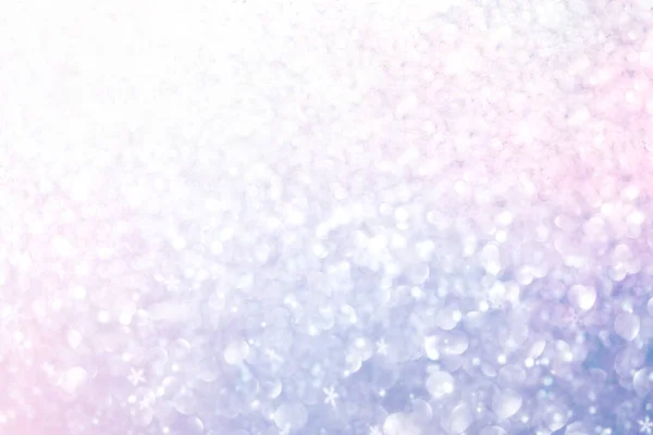 Natal Ano Novo colorido desfocado fundo pastel com flocos de neve e estrelas piscando . — Fotografia de Stock