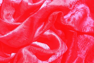 Kırmızı ipek kumaşlar. Hediye konsepti.