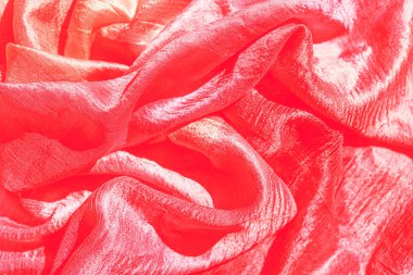 Kırmızı ipek dokular arka plan. Seçici odak.