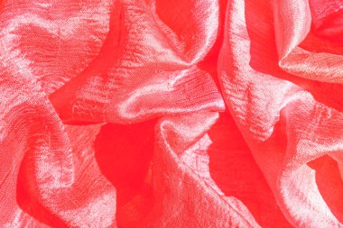 Kırmızı ipek dokular arka plan. Seçici odak.