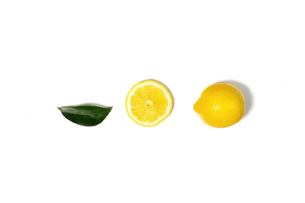 Creative layout made of lemon and green leaf. — Stock Photo, Image