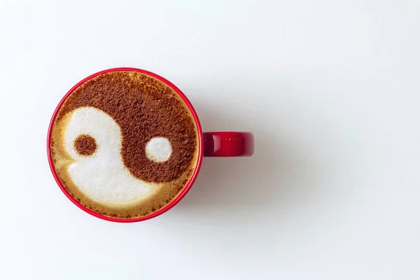 a cup of cappuccino coffee in a ceramic cup on the table