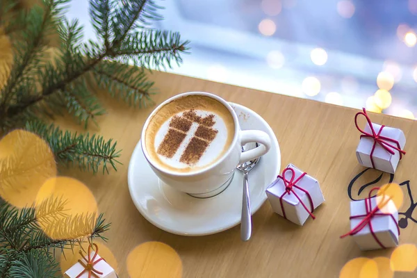 cup of hot cappuccino coffee with gift box latte art