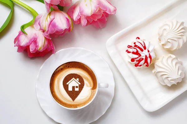 a cup of cappuccino coffee in a ceramic cup on the table