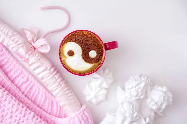 a cup of cappuccino coffee in a ceramic cup on the table