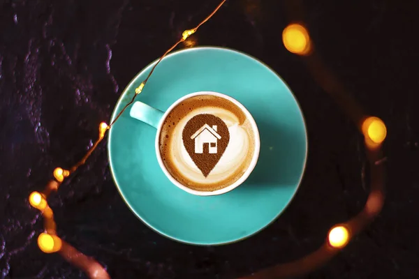 a cup of cappuccino coffee in a ceramic cup on the table