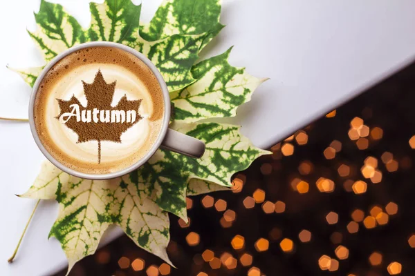 Autumn leaves pattern with coffee cup. Flat lay.