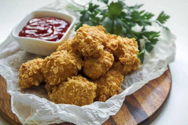 fried chicken with sauce and vegetables