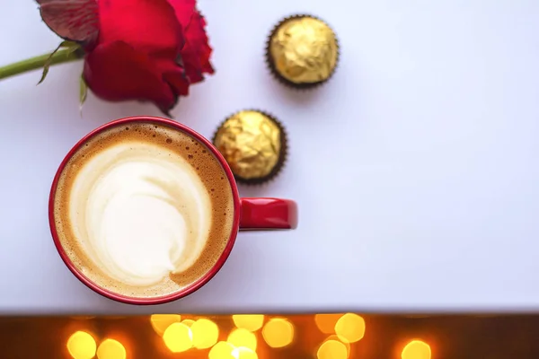 a cup of cappuccino coffee in a ceramic cup on the table