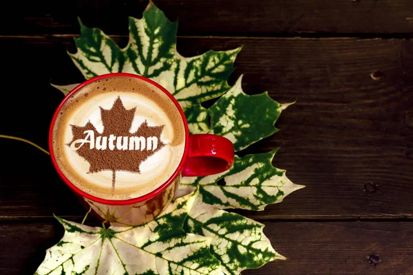 Autumn leaves pattern with coffee cup. Flat lay.