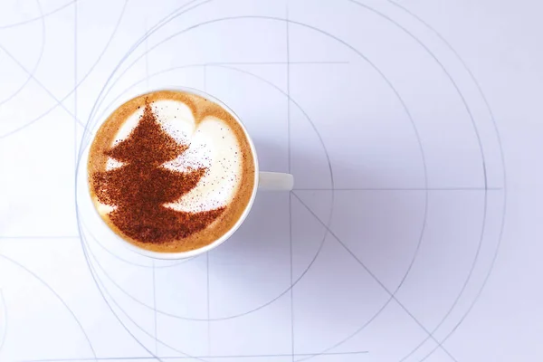 a cup of cappuccino coffee in a ceramic cup on the table