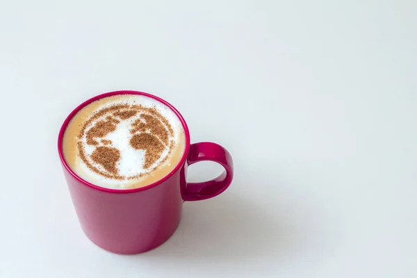 a cup of cappuccino coffee with a pattern of the planet earth made of cinnamon on milk foam