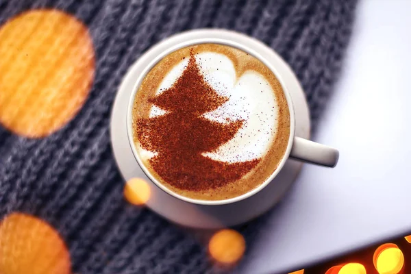 a cup of cappuccino coffee in a ceramic cup on the table