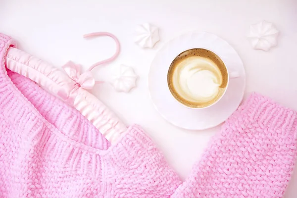 a cup of cappuccino coffee in a ceramic cup on the table