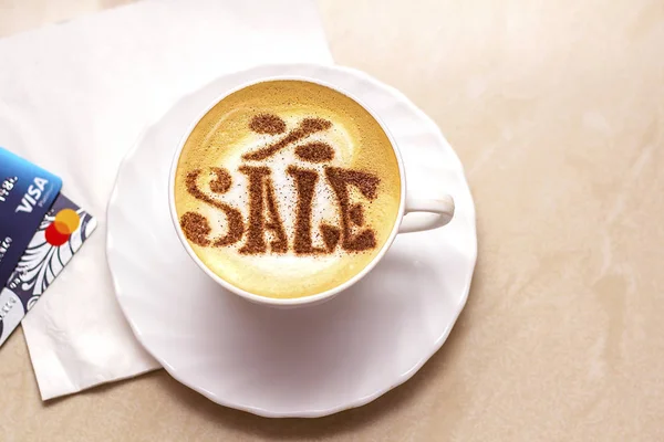 hot cappuccino coffee with Sale symbol latte art in white cup