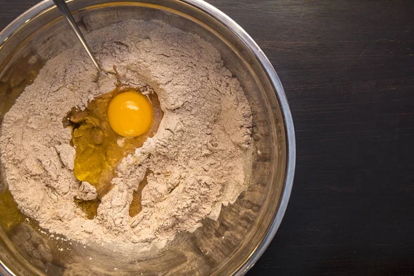 yolk and flour in bowl, baking process