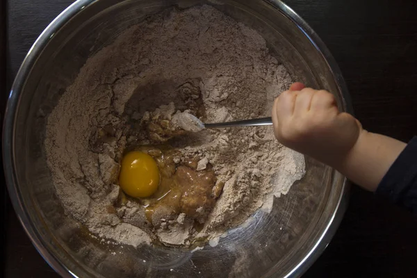 yolk and flour in bowl, baking process