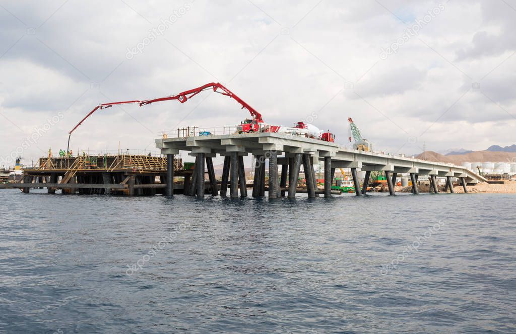 Aqaba, Jordan, 10/10/2015, Construction crane working on a jetty terminal at aqaba new port.