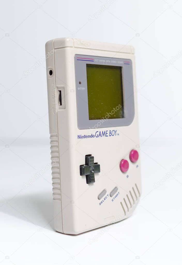 London, england, 05/05/2019 A retro hand held nintendo gameboy game boy original, angled side on, isolated on a white studio background. Nintendo vintage famous iconic portable video game device.