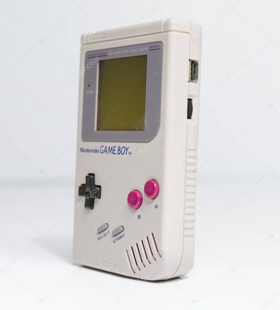 London, england, 05/05/2019 A retro hand held nintendo gameboy game boy original, angled side on, isolated on a white studio background. Nintendo vintage famous iconic portable video game device.