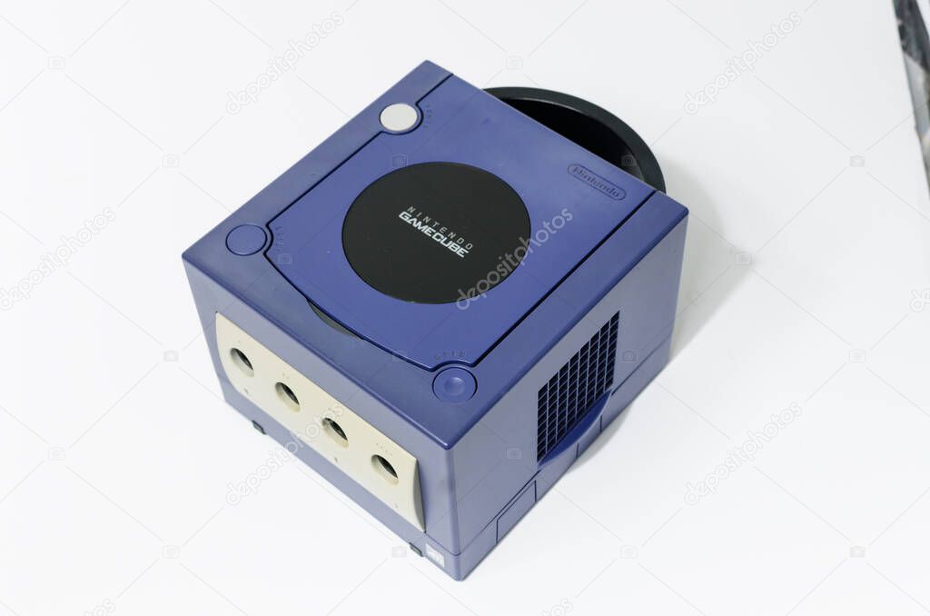 London, england 05/052019 A Purple Nintendo Game Cube Console on a white isolated background. iconic retro vintage video gaming machine. Japanese technology gamecube.
