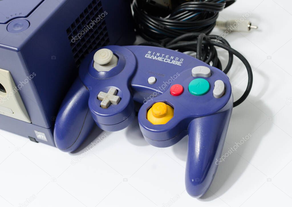 London, england 05/052019 A Purple Nintendo Game Cube Console on a white isolated background. iconic retro vintage video gaming machine. Japanese technology gamecube.