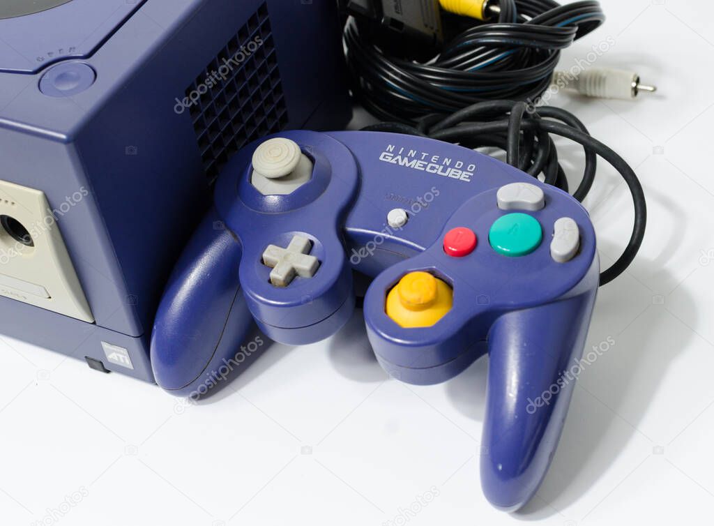 London, england 05/052019 A Purple Nintendo Game Cube Console on a white isolated background. iconic retro vintage video gaming machine. Japanese technology gamecube.