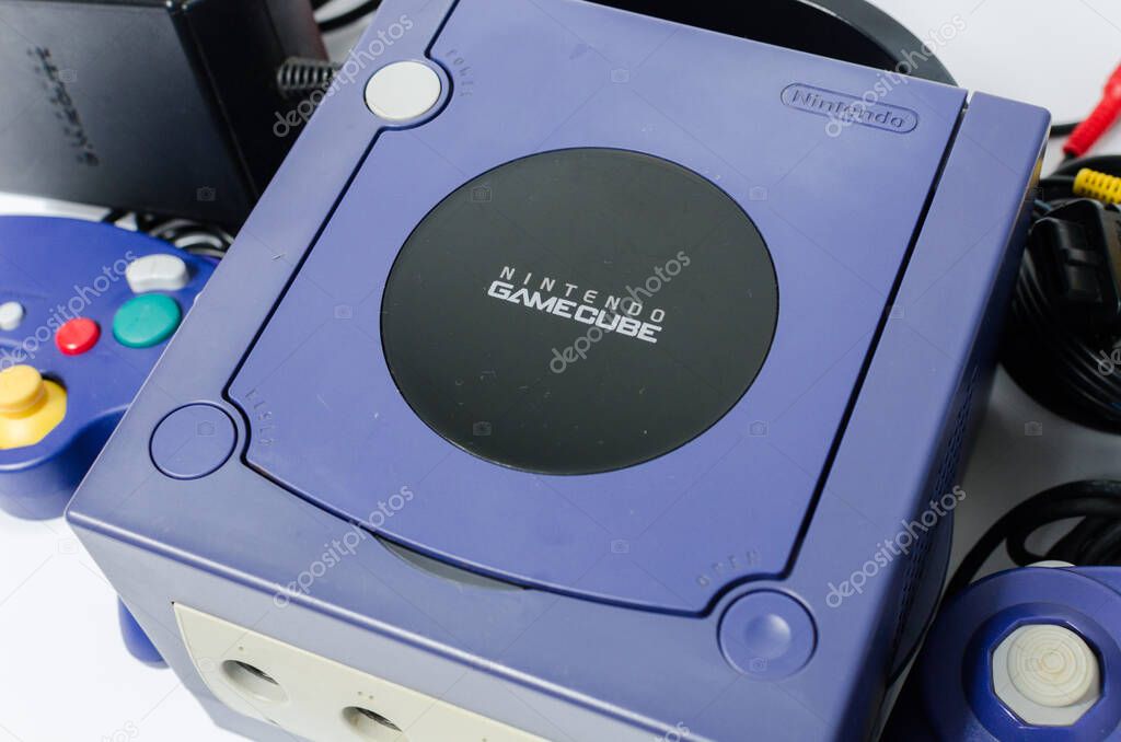 London, england 05/052019 A Purple Nintendo Game Cube Console on a white isolated background. iconic retro vintage video gaming machine. Japanese technology gamecube.