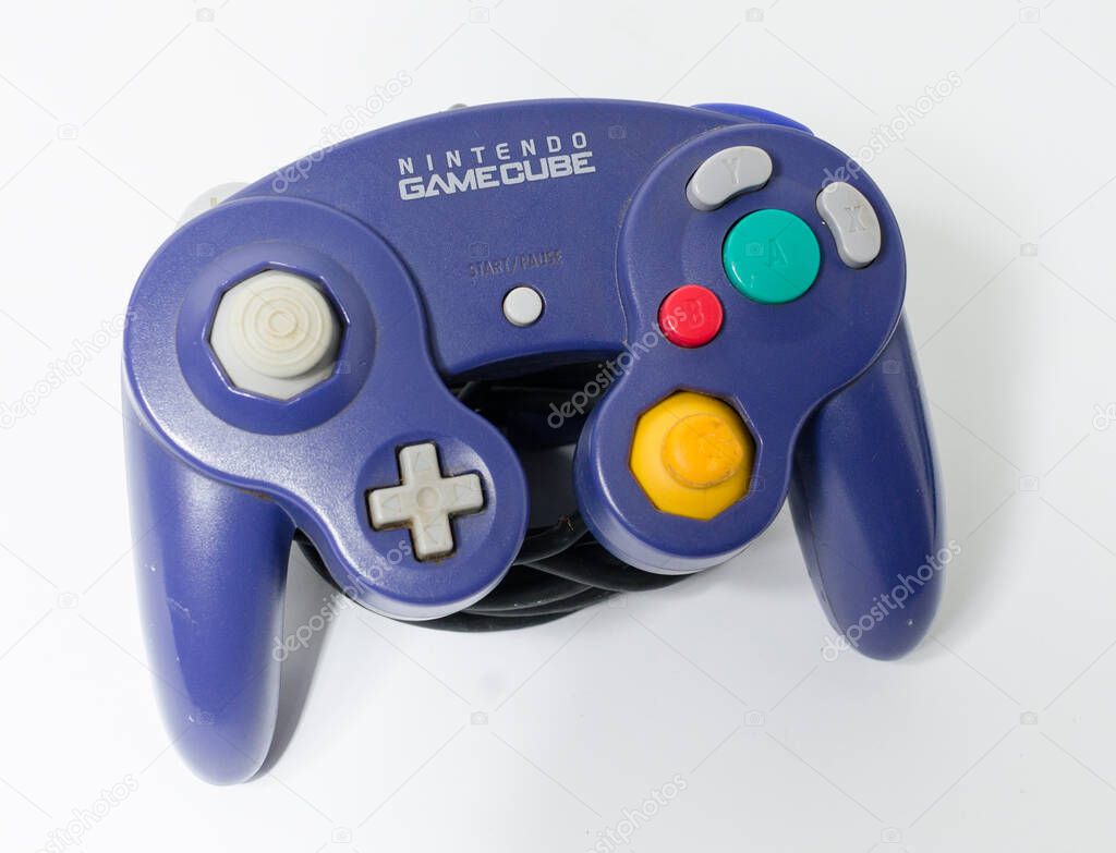 London, england 05/052019 A Purple Nintendo Game Cube Console on a white isolated background. iconic retro vintage video gaming machine. Japanese technology gamecube.