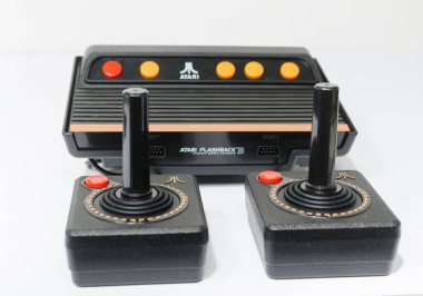 london, england, 05/05/2018 A Retro vintage atari flashback 3 arcade console re issue. A modern plug and play console with a retro 1980s style. classic vintage arcade play. clipart
