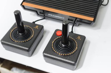 london, england, 05/05/2018 A Retro vintage atari flashback 3 arcade console re issue. A modern plug and play console with a retro 1980s style. classic vintage arcade play. clipart