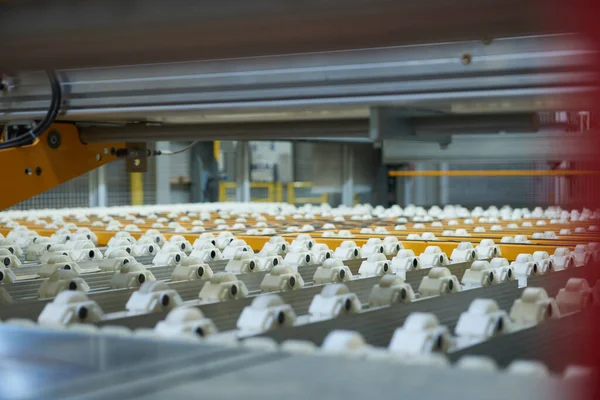 An empty industrial roller conveyor belt in a fully automated factory. roller conveyor to easily move heavy industrial goods around without the need for humans.future of industrial manufacture.